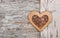 Wooden decorative heart on the birch bark