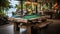 Wooden design pool table in a restaurant with a view of the sea and palm trees