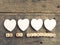 Wooden dices with white heart shapes