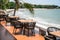 Wooden dining table on restaurant patio at seaside