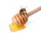 Wooden dipper with honey and bee