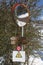 Wooden Directional Signs for Walks, Warning Sign and Parabolic Road Mirror in the Italian Mountains