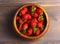 Wooden dish with strawberries. wood background, view from the top