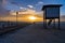 Wooden dock  with beautiful sunset at the background.