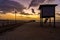 Wooden dock  with beautiful sunset at the background.