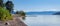 Wooden dock on a calm lake on beautiful summer morning, Okanagan Lake, Canada