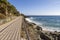 Wooden dock over the cliffs by the sea in Varazze, Italy