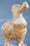Wooden Dodo bird - typical souvenir from Mauritius island over the blue background.