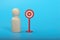 Wooden doll figure and target sign. Target customers, audience outreach, sales generation