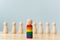 Wooden dolls with rainbow colors are different stand out from crowd
