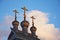 Wooden domes with three crosses of an old Russian Church