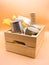 Wooden donation box with food on an orange background. Vertical photography