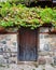 wooden door on the ancient facade