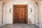 wooden door with architectural arch in an ancient sandstone house in Bur Dubai near Creek area