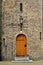 Wooden door in a brick medieval turret
