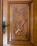 Wooden door with christian symbols: Faith - Cross, Hope - Anchor, Love - Heart