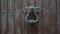 Wooden door detail with big copper latch