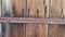 Wooden door detail, old rusty lock