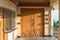 Wooden door detail with shadow of building in area of temple of Lord Shiva at Siddhesvara Dhaam in Namchi. Sikkim, India