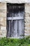 A wooden door deteriorated by time