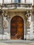 Wooden door entrance to 19th century building in Milan