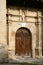 Wooden door of the facade of the church of Santiago Apostol