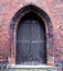 Wooden door on Gothic brick church, Poland