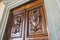 Wooden door inside the medieval Palazzo Vecchio, Florence, Italy