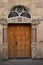 wooden door in a limestone building