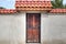 Wooden door with metal ornaments