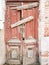 Wooden door of an old destroyed brick house