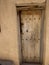 Wooden door of old houses, hamlet in mountains, Oman