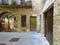 Wooden door in a stone facade. Small window Elegant entrance Rustic