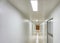 Wooden door on white and clean corridor