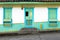 Wooden door and windows painted in bright colors in a traditional colonial house in the town of Salento, in Colombia