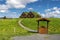 Wooden doorway and walk steps to traditional Icelandic turf houses in Modrudalur farm s