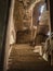 Wooden down stairs in the old brick-built belfry of the church.