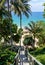 Wooden down way stairs to the beach, with palms around. Naithon beach, Phuket, Thailand