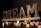 Wooden Dream large word with the wooden blocks around on the black background.