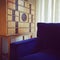 Wooden dresser and blue velvet armchair