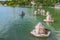 Wooden duck houses with reflection float on Lake Abrau Abrau-Durso, Krasnodar region, Russia