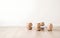 wooden dumbbells on a light wooden floor on light sports hall background