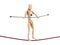 Wooden dummy balancing on the rope