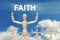 Wooden dummy puppet on sky background with word FAITH