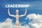 Wooden dummy puppet on sky background with word LEADERSHIP