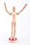 Wooden dummy standing with raised hands.