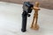 Wooden dummy taking a picture or video with a camera on a tripod