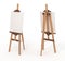 Wooden easel with blank canvas,