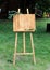 Wooden easel with a board.Copy space, your text here