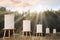 Wooden easels with blank canvases in forest on sunny day